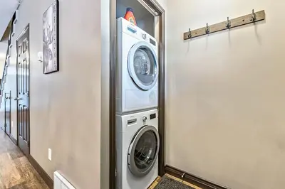 a laundry room with a washer and dryer at Mystic Getaway in Canmore