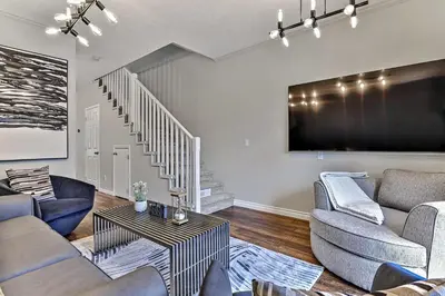 a living room with two couches and a tv at The Lambeth by Samsara Resort Private Entry Panorama Top View 2BR and 2BTH in Canmore