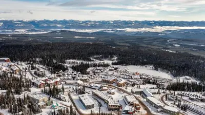an aerial view of a ski resort in the snow at Forest Lane Hideaway - Luxurious Family Friendly Home w Private Hot Tub in Big White