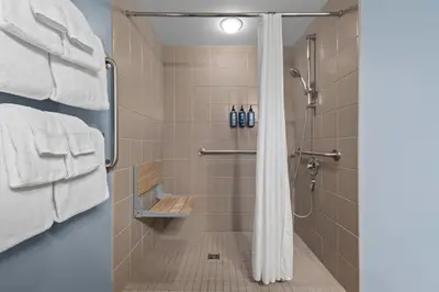 a shower with a shower curtain in a bathroom at WorldMark Victoria in Victoria