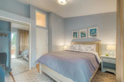 a bedroom with a large bed and a window at Beautiful Newly Reno 2BDM 2 Bth Sleep up to 6 Adults & Kids Mountain View Townhouse Suite in Canmore