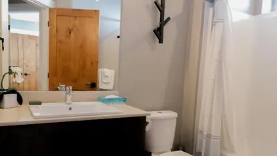 a bathroom with a sink and a toilet at Echo Landing #22 by Bear Country in Sun Peaks