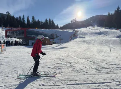 a person on skis in the snow on a ski slope at Listel Whistler, a Coast Hotel in Whistler