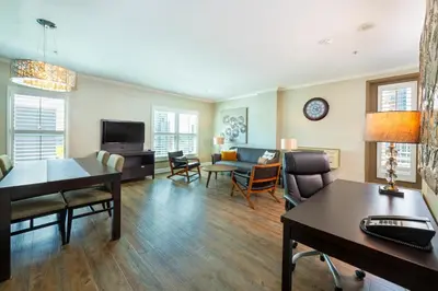 a living room with a couch and a table at Grand Park Hotel & Suites Downtown Vancouver, an Ascend Collection Hotel in Vancouver