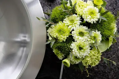 a bouquet of white flowers sitting on a wall at OPUS Vancouver in Vancouver