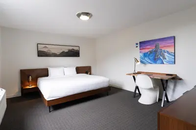 a hotel room with a bed and a desk at Adara Hotel in Whistler