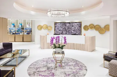 a lobby with purple flowers in a vase on a table at The Westin Bear Mountain Resort & Spa, Victoria in Victoria