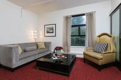 a living room with a couch and a chair at Moda Hotel in Vancouver