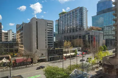 a view of a city with tall buildings at The Sutton Place Hotel Vancouver in Vancouver