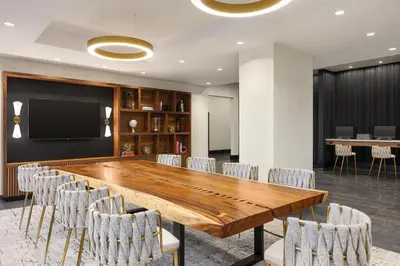 a conference room with a large wooden table and chairs at Radisson Blu Vancouver Airport Hotel & Marina in Richmond