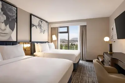 a hotel room with two beds and a window at Radisson Blu Vancouver Airport Hotel & Marina in Richmond