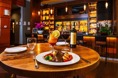 a plate of food on a table in a restaurant at Grand Park Hotel Vancouver Airport, an Ascend Collection Hotel in Richmond