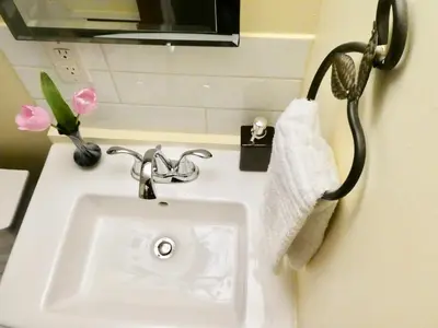 a bathroom with a sink and a towel at Belle Neige Whistler in Whistler