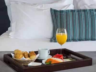a tray of food and a glass of orange juice at Radisson Hotel Vancouver Airport in Richmond