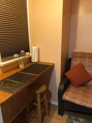 a room with a desk and a chair and a window at Shady Willow Guest House - SMALL Indipendent Units with Seperate Entrance for Travellers in Chilliwack