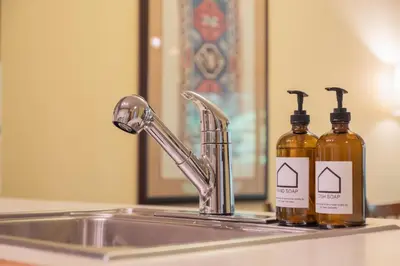 two bottles of soap sitting on top of a sink at The Aspens by Outpost Whistler in Whistler