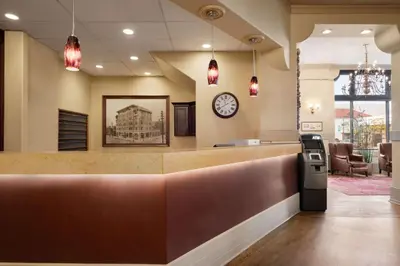a waiting area of a hospital with a clock on the wall at The Plaza Hotel Downtown, Trademark Collection by Wyndham in Kamloops
