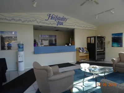 a waiting room with two chairs and a table at Hospitality Inn in Kamloops