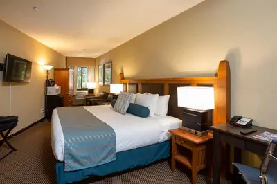 a hotel room with a bed and a desk at Blackcomb Lodge in Whistler