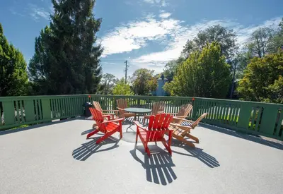 a group of chairs and a table on a patio at Robin Hood Inn and Suites in Victoria