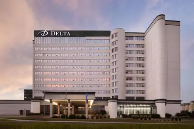 a hotel building with a sign on top of it at Delta Hotels by Marriott Edmonton South Conference Centre in Edmonton