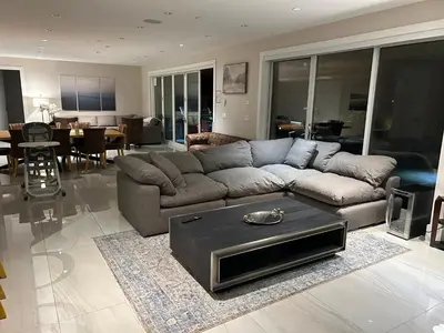 a living room with a couch and a table at Luxury accomodation in West Vancouver in West Vancouver