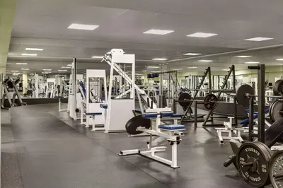 a gym with a lot of equipment in it at Wyndham Edmonton Hotel and Conference Centre in Edmonton