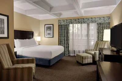 a hotel room with a bed and a television at Wyndham Edmonton Hotel and Conference Centre in Edmonton