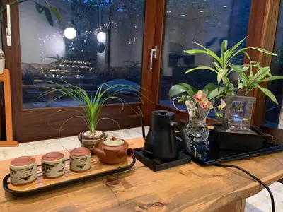 a table with a tray with pots and plants on it at White House in Vancouver