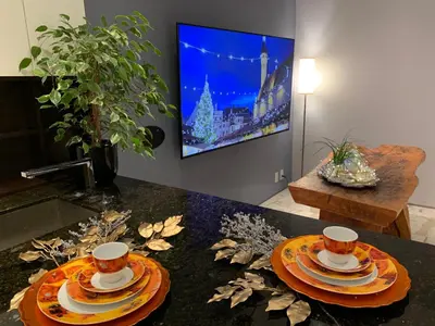 a living room with two plates and cups on a table at White House in Vancouver