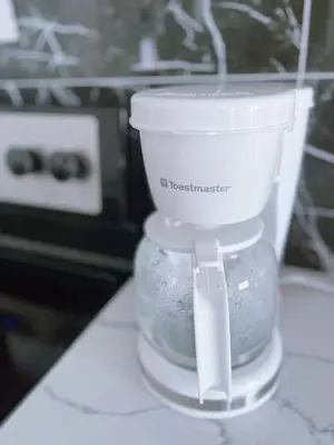 a white food processor sitting on top of a counter at Banff -Calgary Garden &3 mins Bus station Close C-Train&Free Parking in Calgary
