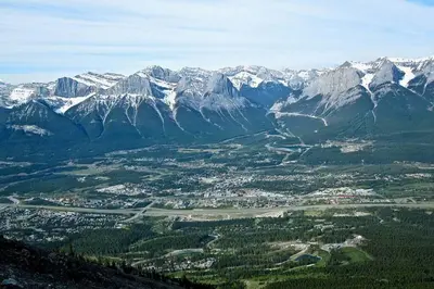 an aerial view of a valley with snow covered mountains at Banff Gate vacation townhouse in Canmore