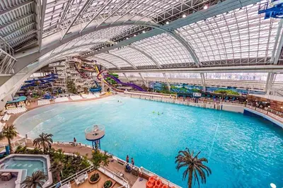 a large indoor swimming pool in a building at Stylish Chic Home - King Bed - Free Parking & Netflix - Fast Wi-Fi - Long Stays Welcome in Edmonton