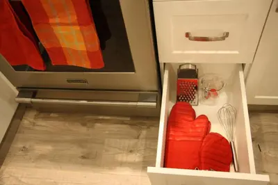 a drawer in a kitchen with a stove and some food at Vancouver Traveller Cottage in Vancouver