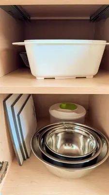 a kitchen shelf with a bowl and a bowl and a plate at Family Mountain Escape - Three Townhouses in One in Canmore