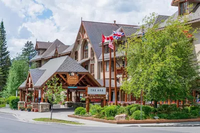 a large building with flags on the front of it at Banff Caribou Lodge and Spa in Banff