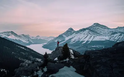 a person standing on top of a mountain at Banff Park Lodge in Banff