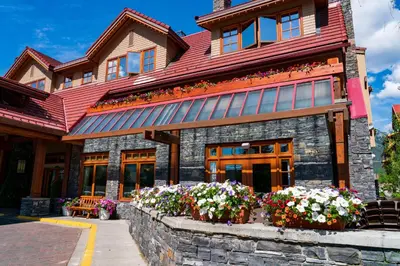 a house with flowers in front of it at Banff Ptarmigan Inn in Banff