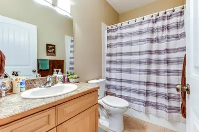 a bathroom with a sink and a toilet at Grandma's Elephant Hideaway in Penticton