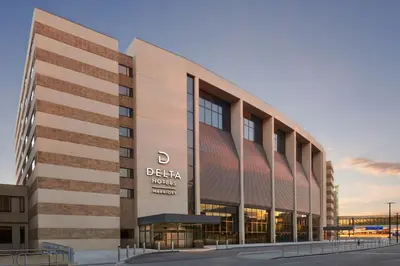 a rendering of a building with a sign on it at Delta Hotels Calgary Airport In-Terminal in Calgary