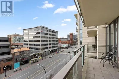 a balcony with a view of a city street at WaterFalls Hotel - Suite in Falls Downtown with pool in Victoria