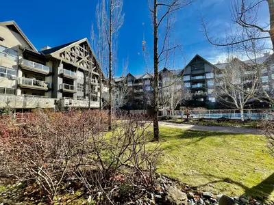 a park in front of a apartment building at Best ski in ski out condo at Whistler in Whistler