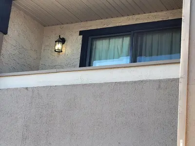 a window on a house with a light on it at Super 8 North Red Deer in Red Deer