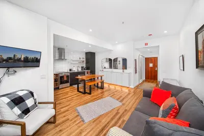 a living room with a couch and a table at Luxury and Modern Studio at Blackcomb base in Whistler