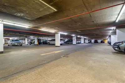 an empty parking garage with cars parked in it at Best Western Plus Village Park Inn in Calgary
