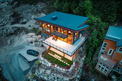 an overhead view of a house with a blue roof at Luxe Modern Timberframe - Iconic Panorama Views with AC in Nelson