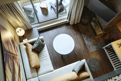 an overhead view of a living room with a couch and a table at Kananaskis Mountain Lodge, Autograph Collection in Kananaskis Village