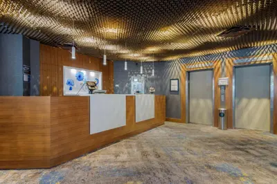 a lobby with a reception desk in a building at Best Western Premier Chateau Granville Hotel & Suites & Conference Centre in Vancouver