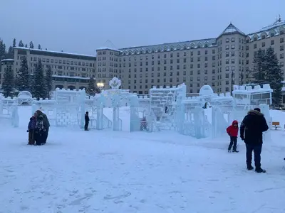 a group of people standing in front of an ice sculpture at Skyline Getaway - Mountain Views - Pool - Hot Tub in Canmore