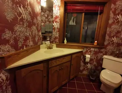 a bathroom with a sink and a toilet at Walkon Waterfront Castle Cove Inn in Chemainus